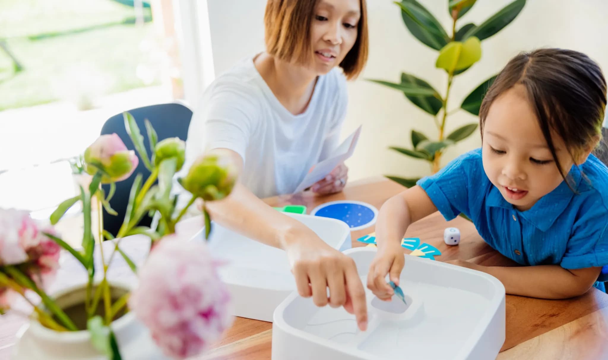 Child and parent playing the Turtle Hatch Game from The Problem Solver Play Kit